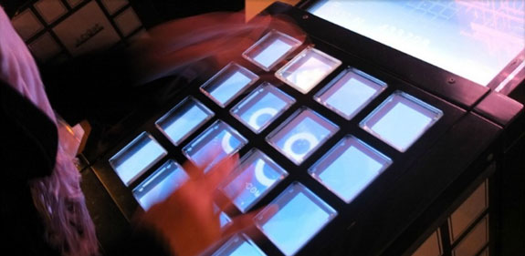 A player taps to the music of Jubeat, an electronic game at an arcade in Nagoya, Japan. (Photo: Geoffrey Rockwell) 